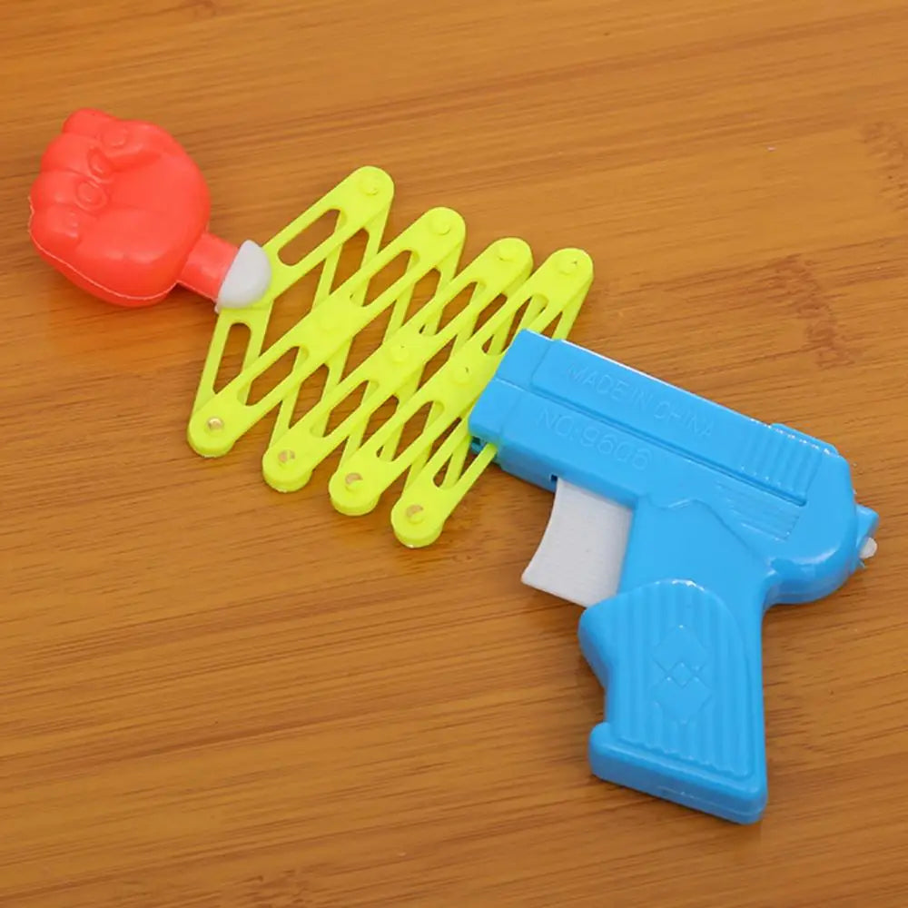 Retractable Fist Shooter Trick Toy Gun Funny Child Kids Plastic