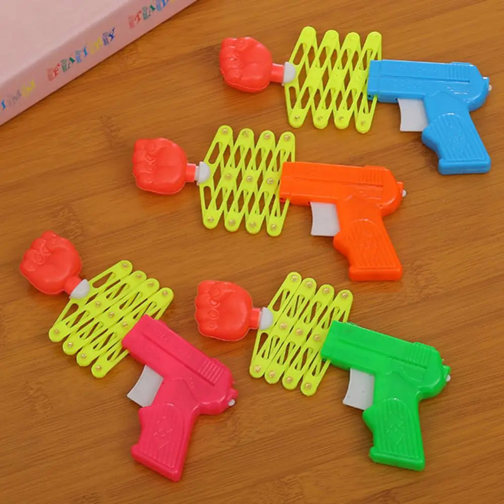 Retractable Fist Shooter Trick Toy Gun Funny Child Kids Plastic